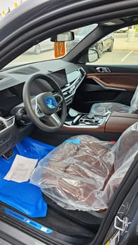 Ottawa, ON Canada - 09.27.2023: Luxury BMW Vehicle Interior with Protective Covers, Clean and Modern Design, Ready for the Road.