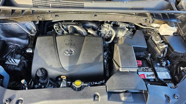 Ottawa, ON Canada - 09.09.2023: Toyota Vehicle Engine Compartment Displaying Mechanical Components and Systems for Automotive Use.