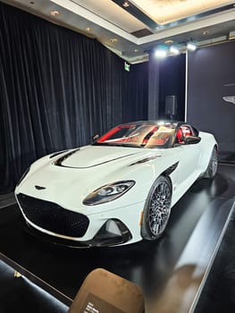 Toronto, ON Canada - 02.23.2024: Elegant White Sports Car Displayed at an Exhibition with Sleek Design and Modern Features.