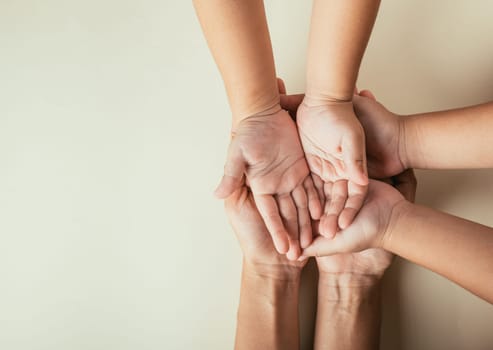 Celebrating Family Day, Parents and kid hold empty hands top view isolated. Embracing togetherness support and the continuity of family heritage.