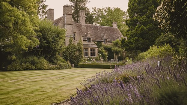 A picturesque stone manor house nestled amidst vibrant lavender garden in the English countryside.