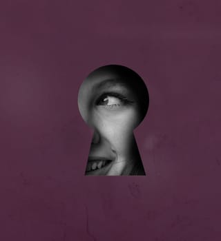 A keyhole offers a glimpse of a smiling face, capturing a moment of curiosity. The playful expression is accentuated by the unique framing and color of the background.