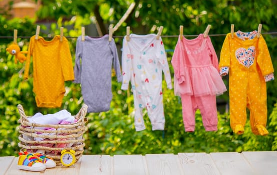 Children's clothes drying on a rope. Selective focus..