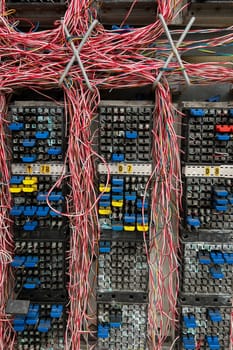 Fiber optical network cables panel. Old telephone cross connection box.