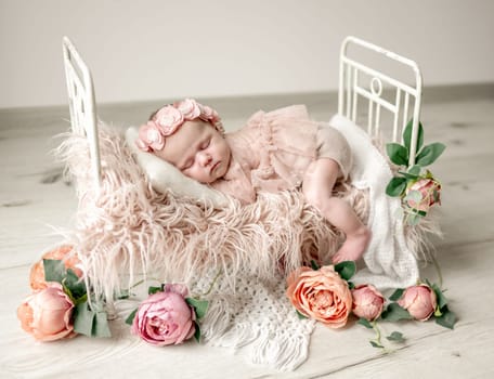 Newborn Baby Girl Sleeping In Tiny Crib During Studio Photoshoot