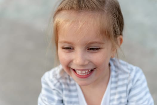 Girl Laughing In A Close-Up Portrait
