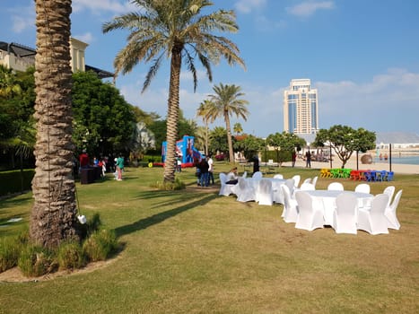 Doha, Qatar - Nov 22. 2019 . Festive tables and chairs on beach - getting ready for the celebration