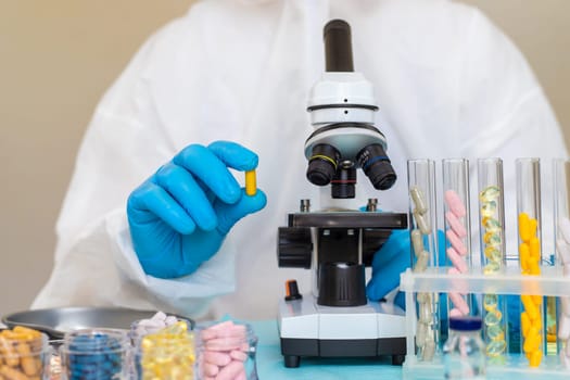 examine drugs in the laboratory. Selective focus. pills.