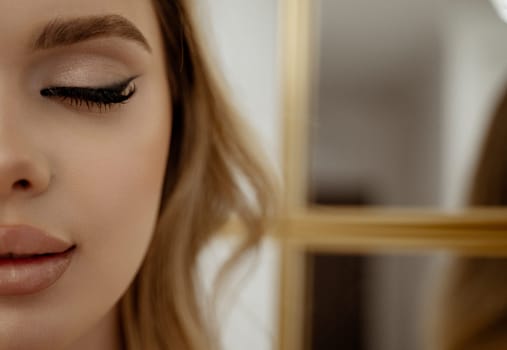 Beauty face makeup. Make up. Eyelashes extensions. Perfect Make-up closeup. Foundation. Cosmetic Eyeshadows, eyebrows. Beauty Girl with Perfect Skin. Eyelashes. Makeover