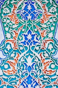 beautiful carved wooden painted background in Museum of Art of Uzbekistan with traditional Uzbek ornaments and colorful oriental patterns in Tashkent