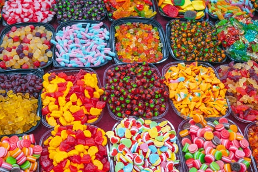 assortment of marmalade and chewable candies on the counter at a candy store in oriental market