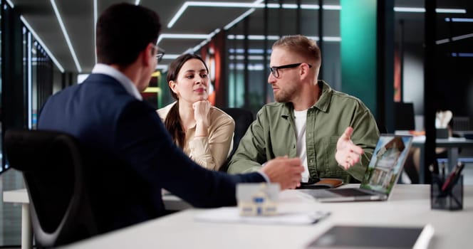 Young Hispanic Couple Meets Professional Realtor To View Potential Homes.