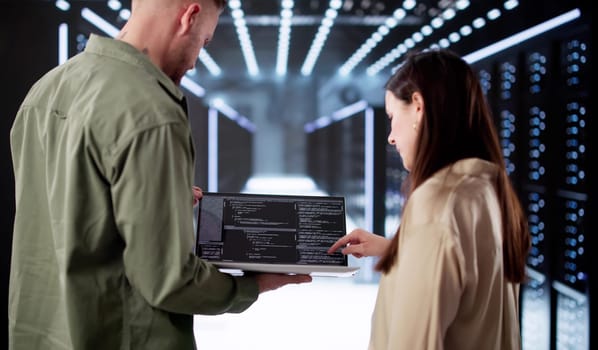 Tech-savvy Engineer Setting Up AI In Data Center Server Room.