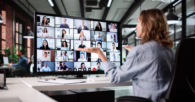 Successful Businesswoman Leads Remote Virtual Video Conference With Team Members