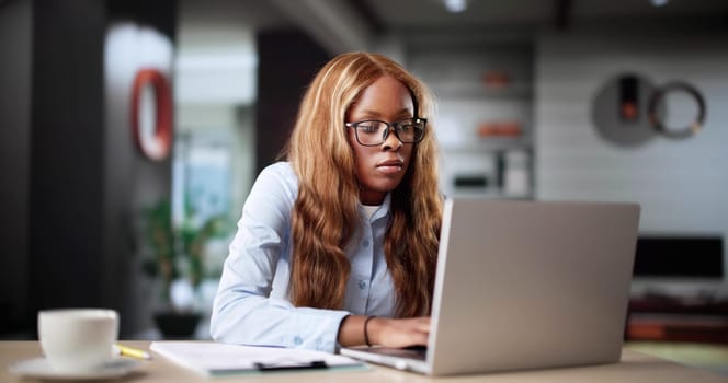 Woman Calculating Tax Bill On Laptop Computer Online For Finances.