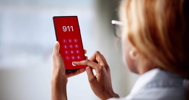 Urgent Call For Help: Woman Dialing Emergency Number On Phone.