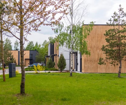 Facade of the stylish, urban, modern townhouses, ergonomically designed and made of ecological materials