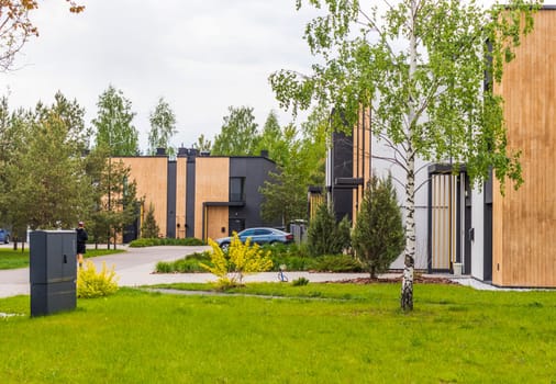 Facade of the stylish, urban, modern townhouses, ergonomically designed and made of ecological materials