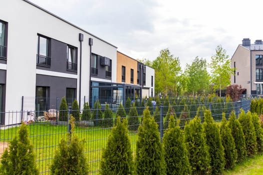Facade of the stylish, urban, modern townhouses, ergonomically designed and made of ecological materials
