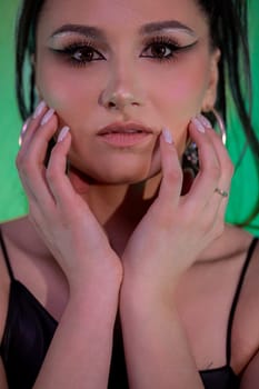 A striking portrait featuring bold makeup and expressive styling against a vibrant, dynamic background