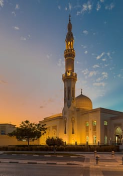 UAE, Dubai, 23 September 2024: Illuminated Jumeirah mosque Masjid Rawda Al Abrar Mosque at dusk, It is also an educational center for cultural understanding. Muslim religion concept. High quality photo