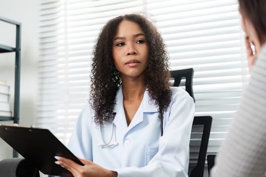 A doctor listening attentively to a patient's concerns during a consultation, emphasizing empathy and understanding in healthcare.