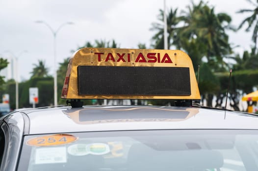 Close-up of the Asian taxi sign on the roof of the car. Nha Trang, Vietnam - December 12, 2024