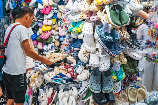Clogs and other Crocs products are for sale in a shoe store. Nha Trang, Vietnam - December 13, 2024.