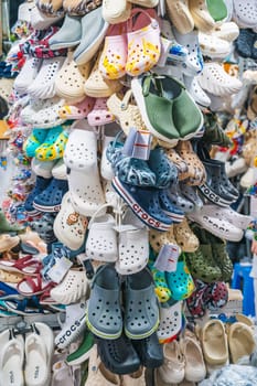 Clogs and other Crocs products are for sale in a shoe store. Nha Trang, Vietnam - December 13, 2024.