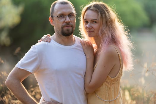 Romantic couple enjoying a peaceful moment together in nature, embracing their love and connection