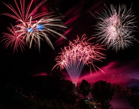 Firework display on the night sky at a festival