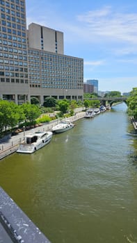 Ottawa, ON Canada - 07.03.2024: Picturesque Ottawa Canal Scene with Boats, Buildings, and Tranquil Waterscape on Sunny Day.