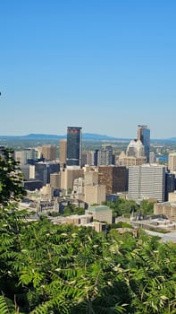 Montreal, QC Canada - 07.01.2024: Montreal Skyline Vista A Captivating Urban Panorama Under a Clear Blue Sky, Quebec, Canada.