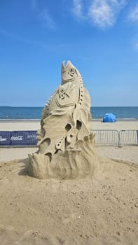 Boston, MA USA - 08.05.2024: Magnificent Sand Sculpture of Two Fish on Beach, Summer Art Installation Display.