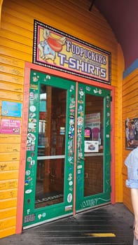 Destin, FL USA - 12.27.2024: Whimsical Storefront Entrance with Colorful Signage and Eclectic Decorations. Tourist Spot.