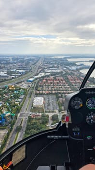 Orlando, FL USA - 12.31.2024: Aerial View of a Cityscape with Highways, Residential Areas, and Water Park from Helicopter.