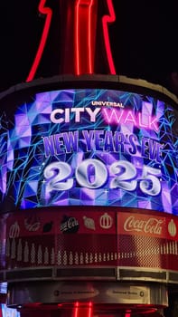 Orlando, FL USA - 12.31.2024: Festive New Year s Eve Celebration Display, City Walk Glowing with Anticipation for 2025.