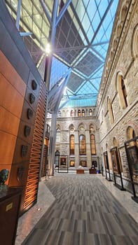 Ottawa, ON Canada - 03.02.2025: Architectural Marvel Interior View of a Museum with Glass Ceiling and Stone Walls.