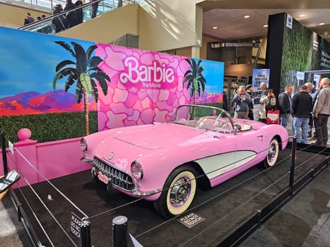 Toronto, ON Canada - 02.23.2024: Classic Pink Barbie Convertible Car Display at an Expo, Nostalgic Automotive Presentation