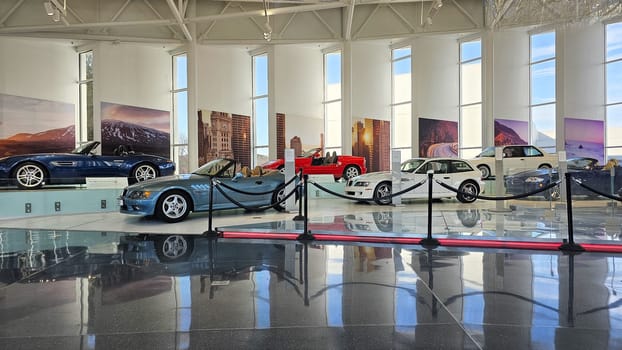 Greer, SC USA - 12.25.2024: Collection of Classic Automobiles Displayed in a Brightly Lit Exhibition Hall, Day Time.