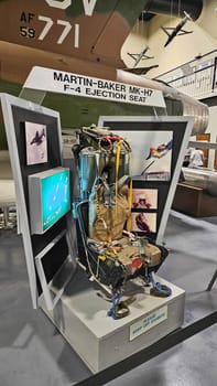 Eglin AFB, FL USA - 12.27.2024: Vintage Aircraft Ejection Seat Display, Aviation Heritage Exhibition, Museum Artifact.