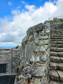 Stone Steps to Mountain Summit Under Cloudy Sky, Scenic Viewpoint, Hiking Adventure at Whiteface Mountain.