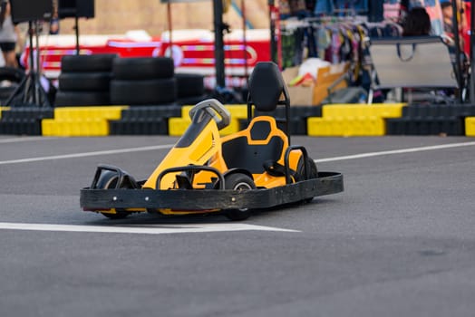 Yellow and black Go-kart racing thrill. A lineup of go kart machines is poised for an exciting outdoor motorsport competition.