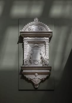 London, UK - May 07, 2025 - Plaster cast of A Marble Tabernacle of The Sacrament from the Church of S. Croce made by Mino da Fiesole displayed in The V&A (Victoria and Albert Museum) in London, use it as your Wallpaper, Poster and Space for text, Selective focus.