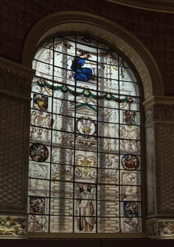 London, UK - May 07, 2025 - The magnificent of Large stained glass windows in the central hall of of The Gamble Room inside The V&A (Victoria and Albert Museum) in London. the world's oldest museum restaurant, use it as your Wallpaper, Poster and Copy space, Selective focus.