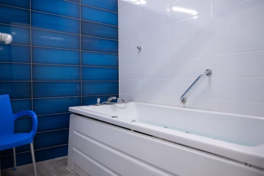 Jacuzzi Therapy Room.Jacuzzi bathtub in a therapy room, clean and ready for a relaxation or medical spa treatment.