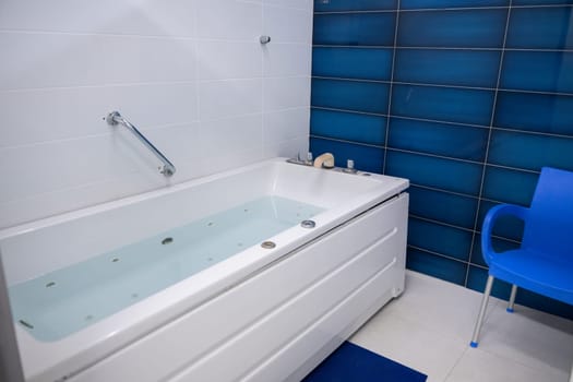Jacuzzi Therapy Room.Jacuzzi bathtub in a therapy room, clean and ready for a relaxation or medical spa treatment.