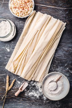 Baking preparation of savory pie with phyllo dough sheets stuffed with feta cheese