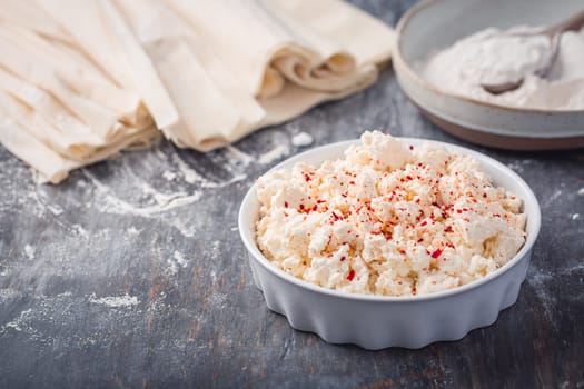 Baking preparation of savory pie with phyllo dough sheets stuffed with feta cheese