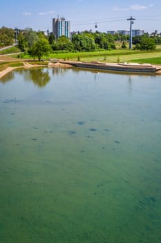 Pond in Mannheim city with ropeway connecting parks during federal horticulture and garden shows (Bundesgartenschau BUGA), Germany